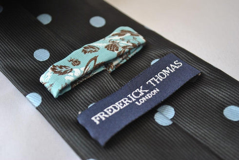 black tie with light blue polka dots